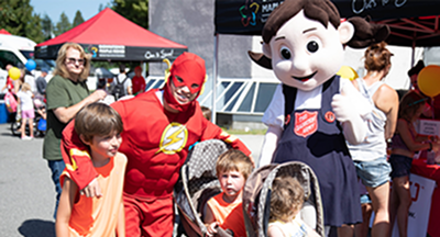 Children and families at a local fair during the Salvation Army back-to-school event.