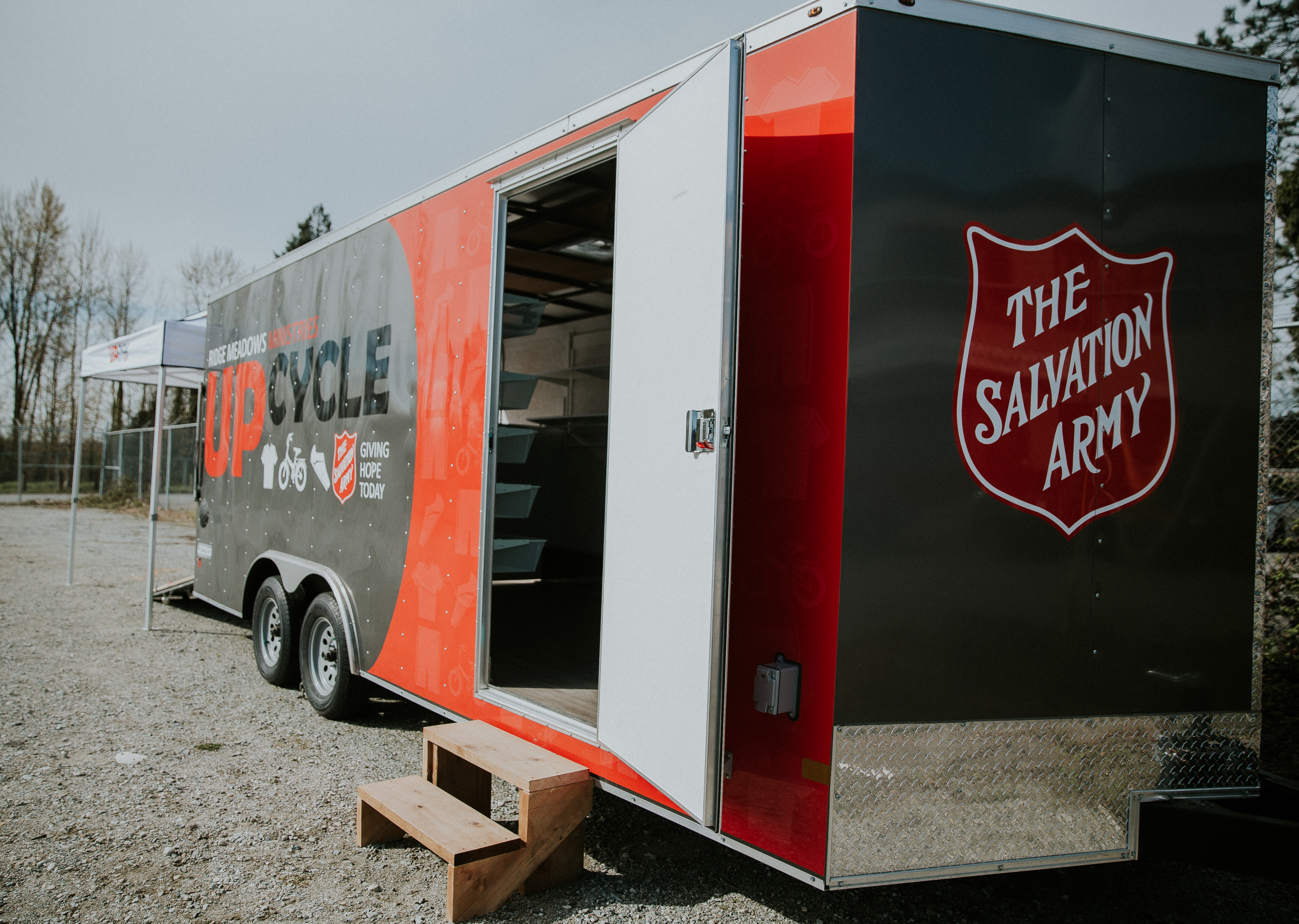 The Salvation Army UpCycle clothing trailer parked outdoors.